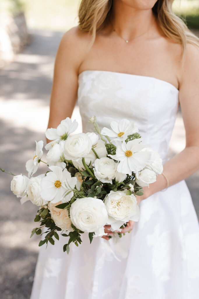 Beautiful white wedding bouquet with cosmos
